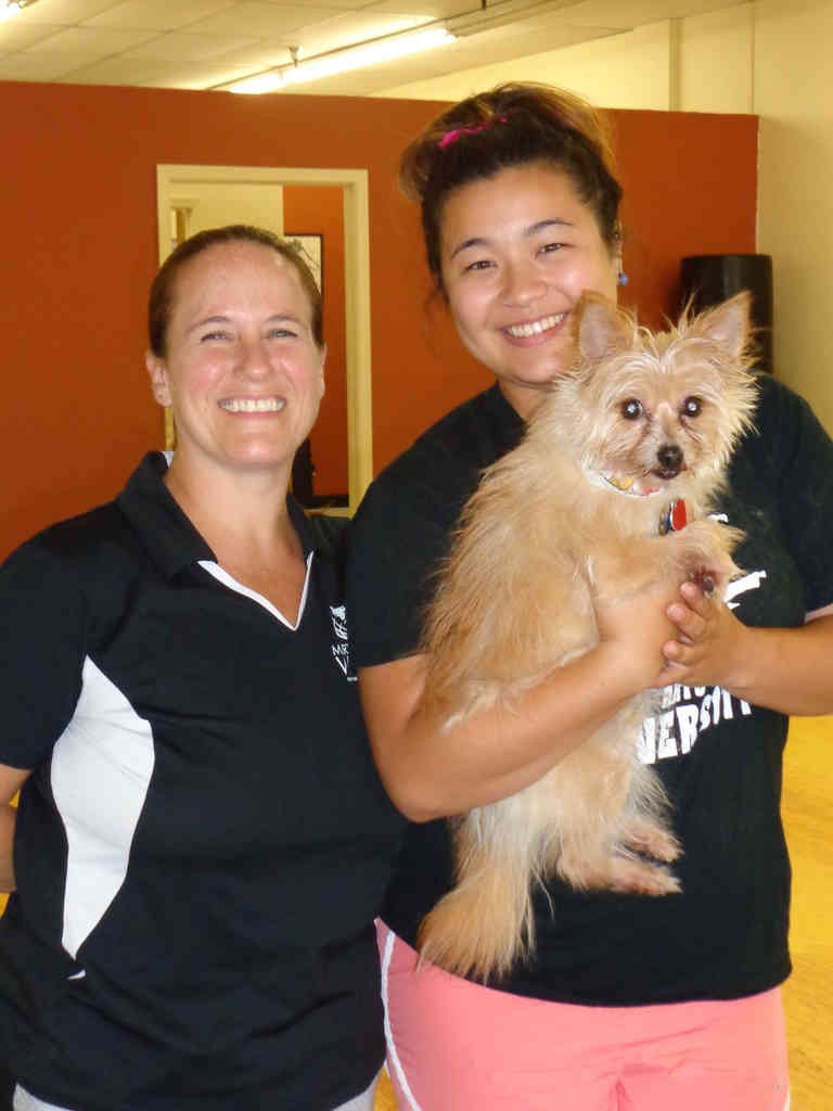 Instructor Susan (left) and Instructor Mia (right) holding “Chip” 